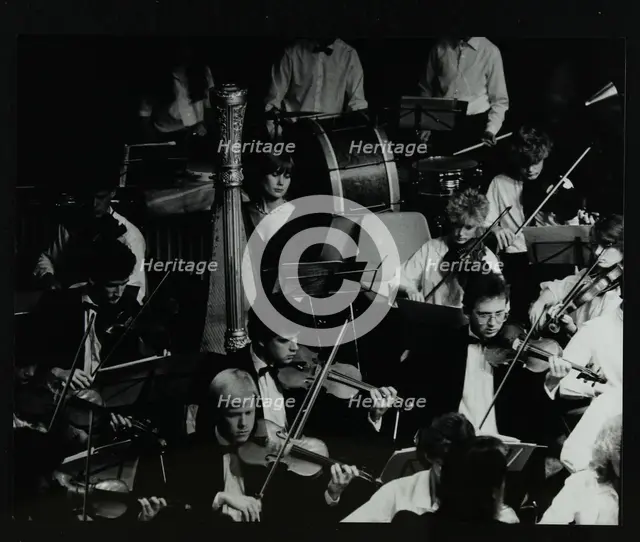 The Mid Herts Youth Orchestra playing at the Forum Theatre, Hatfield, Hertfordshire, July 1986. Creator: Denis Williams.