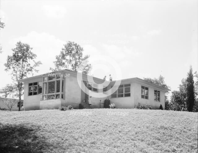 The model house nears completion, Hightstown, New Jersey, 1936. Creator: Dorothea Lange.