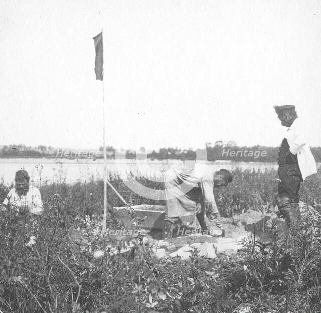 The moment of laying the benchmark on the river bank, 1909. Creator: Vladimir Ivanovich Fedorov.