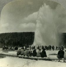The Most Famous Sight in Yellowstone Park, "Old Faithful" Geyser in Action c1930s. Creator: Unknown