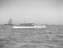 The motor launch Cygnet under way, 1912. Creator: Kirk & Sons of Cowes