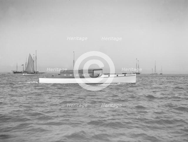 The motor launch 'Cygnet' under way, 1912. Creator: Kirk & Sons of Cowes.