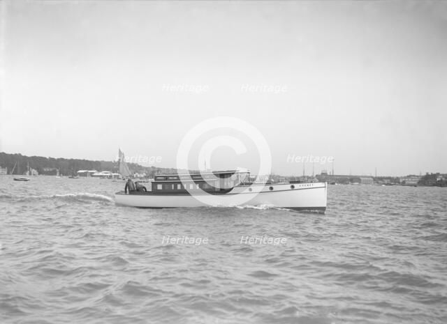 The motor launch 'Cygnet' under way, 1912. Creator: Kirk & Sons of Cowes.