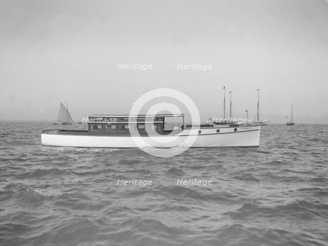 The motor launch 'Cygnet' under way, 1912. Creator: Kirk & Sons of Cowes.