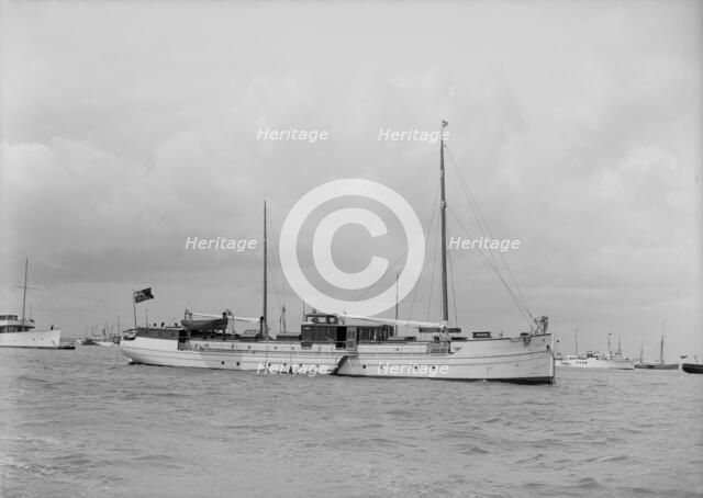 The motor yacht 'La Toquade' at anchor, 1939. Creator: Kirk & Sons of Cowes.
