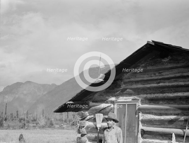 The mother, father, and hardworking fifteen-year-old son in yard..., Boundary County, Idaho, 1939. Creator: Dorothea Lange.