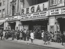 The movies are popular in the Negro section of Chicago, Illinois, April 1941. Creators: Farm Security Administration, Russell Lee