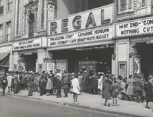The movies are popular in the Negro section of Chicago, Illinois, April 1941. Creators: Farm Security Administration, Russell Lee