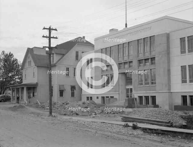 The new WPA courthouse alongside the old county courthouse, Bonners Ferry, Idaho, 1939. Creator: Dorothea Lange.