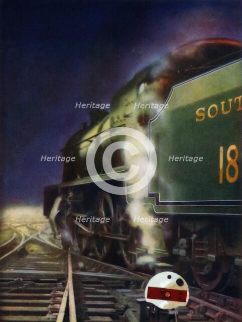'The Night Journey. A mixed-traffic locomotive of the Southern Railway at a cross-over', 1935. Creator: Unknown.