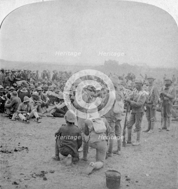 The overpowered Boer prisoners resting on the road from Paardeberg to Modder River, 1900. Artist: Underwood & Underwood
