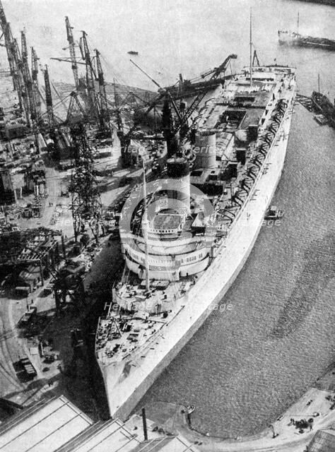 The ocean liner RMS 'Queen Mary', Clydebank, Glasgow, 1934 (1935).Artist: John Brown & Company