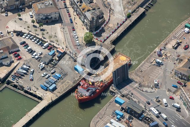 The offshore supply vessel Putford Aries passing through Lowestoft bascule bridge, Suffolk, 2021. Creator: Damian Grady.