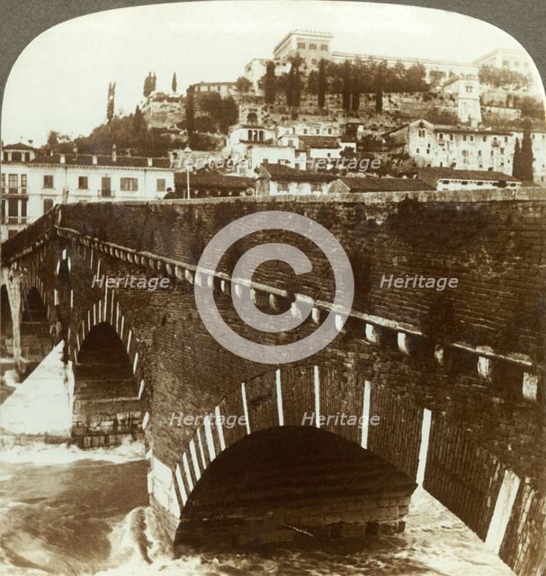 'The old Roman "Ponte Pietra" and castle of S. Pietro (N.E.), Verona, Italy', c1909. Creator: Unknown.