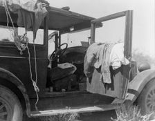 The only home of a depression-routed family of nine from Iowa, 1936. Creator: Dorothea Lange