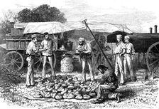 The Autumn Campaign: steam bakery - drawing a batch of loaves, 1872. Creator: Unknown