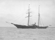 The auxiliary schooner Xarifa at anchor, 1912. Creator: Kirk & Sons of Cowes