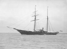 The auxiliary schooner Xarifa at anchor, 1912. Creator: Kirk & Sons of Cowes