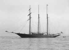 The auxiliary schooner La Cigale at anchor, 1913. Creator: Kirk & Sons of Cowes