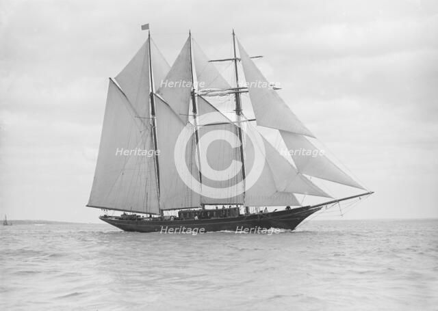 The auxiliary schooner 'La Cigale' sailing close-hauled, 1913. Creator: Kirk & Sons of Cowes.