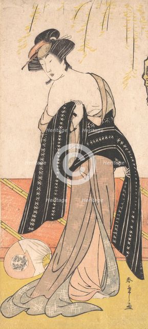 The Actor Nakamura Riko as an Oiran Tying Her Obi, ca. 1779. Creator: Shunsho.