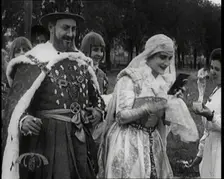 The Actor Henny Porten Dressed in Period Costume Putting on Make up from a Powder Compact..., 1920s. Creator: British Pathe Ltd