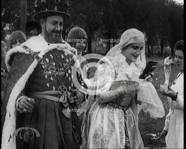 The Actor Henny Porten Dressed in Period Costume Putting on Make up from a Powder Compact..., 1920s. Creator: British Pathe Ltd.