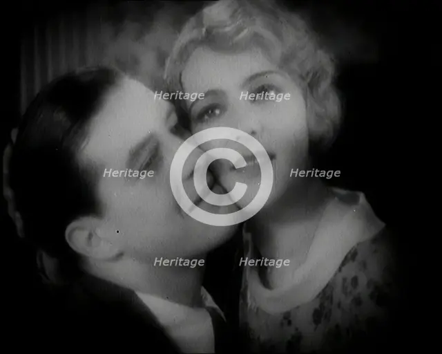 The Actor Ray Milland Embracing a Female British Actor, 1920s. Creator: British Pathe Ltd.