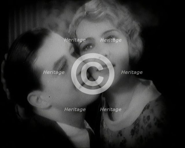 The Actor Ray Milland Embracing a Female British Actor, 1920s. Creator: British Pathe Ltd.