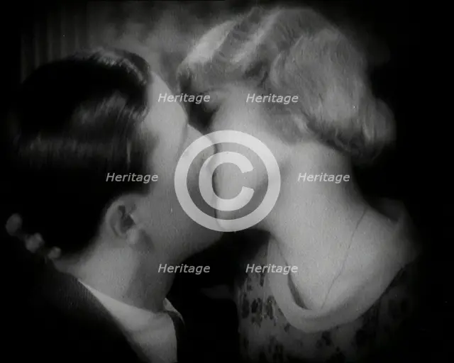 The Actor Ray Milland Kissing a Female British Actor, 1920s. Creator: British Pathe Ltd.