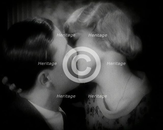 The Actor Ray Milland Kissing a Female British Actor, 1920s. Creator: British Pathe Ltd.