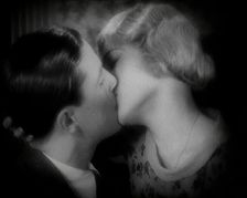The Actor Ray Milland Kissing a Female British Actor, 1920s. Creator: British Pathe Ltd