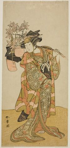The Actor Yamashita Kinsaku II as Odai, an Eboshi (Hat) Seller, in the Play Hana-zumo..., c. 1775. Creator: Shunsho