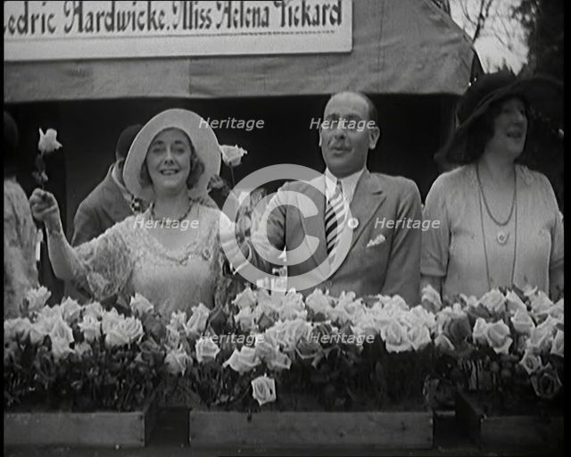 The Actors Helena Pickard and Cedric Hardwicke Holding Roses, 1920s. Creator: British Pathe Ltd.
