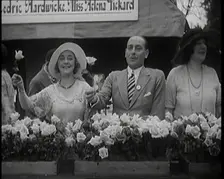 The Actors Helena Pickard and Cedric Hardwicke Holding Roses, 1920s. Creator: British Pathe Ltd