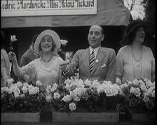 The Actors Helena Pickard and Cedric Hardwicke Holding Roses, 1920s. Creator: British Pathe Ltd