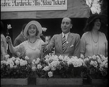 The Actors Helena Pickard and Cedric Hardwicke Holding Roses, 1920s. Creator: British Pathe Ltd