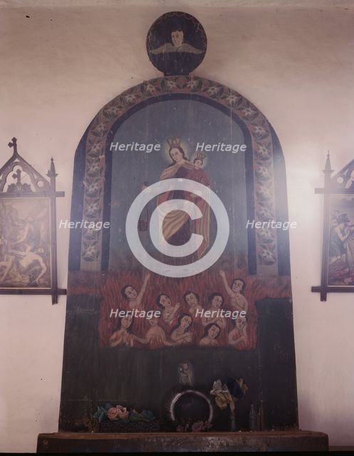 The altar of Nuestra Senora del Carmel on the south wall of the church, Trampas, N.M., 1943. Creator: John Collier.