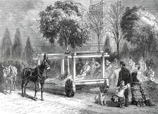The American Centennial Exhibition at Philadelphia: transplanting trees in the grounds, 1876. Creator: Unknown