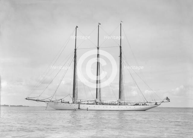 The American three mast schooner 'Karina' at anchor, 1912. Creator: Kirk & Sons of Cowes.