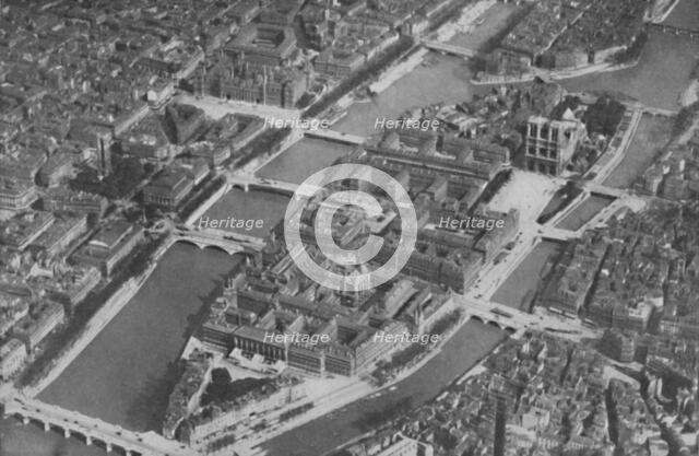 'The Ancient Island Heart of Paris With Its Nine Bridges Seen From The Air', c1935. Artist: Unknown.