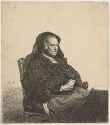 The Artist's Mother Seated at a Table Looking Right: Three-Quarter Length, ca. 1631. Creator: Rembrandt Harmensz van Rijn