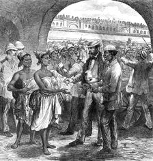 The Ashantee War: paying...Fantee women carriers at Cape Coast Castle...by our special artist, 1874. Creator: Unknown
