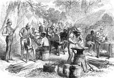 The Ashantee War: sharpening cutlasses...at Prah-Su, from a sketch by our special artist, 1874. Creator: Unknown