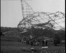 The Burnt Remains of the R-101 Airship Lying on the Ground After Fire and Destruction, 1930. Creator: British Pathe Ltd