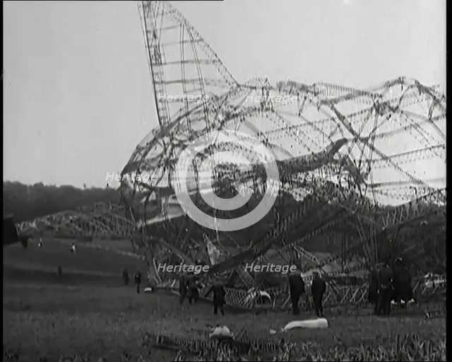 The Burnt Remains of the R-101 Airship Lying on the Ground After Fire and Destruction, 1930. Creator: British Pathe Ltd.