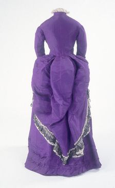 The back view of a fashionable day dress, c1875
