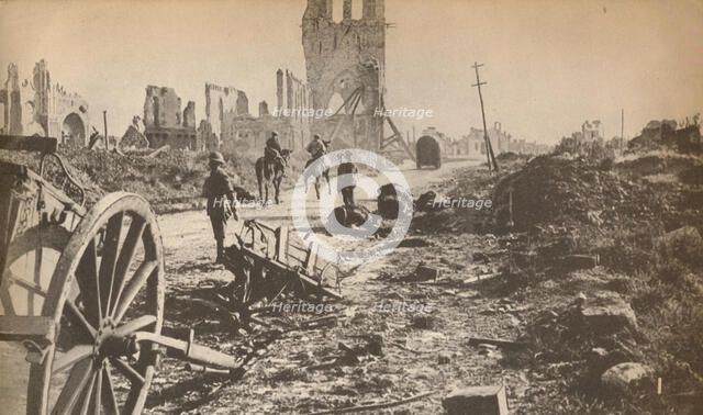 'The battered remains of Ypres after the last shell had done its worst, showing the ruins of the fam Artist: Unknown.
