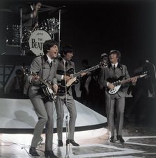 The Beatles - Paul McCartney, John Lennon, Ringo Starr, George Harrison - performing in 1962
