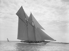 The beautiful schooner Cetonia making good headway, 1911. Creator: Kirk & Sons of Cowes